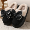 Bowknot plush slippers for women with suede upper, rubber sole, and short plush lining in bow brown, black, or khaki.