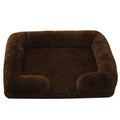 Plush round dog bed in beige brown with raised edges and a removable inner sleeve.