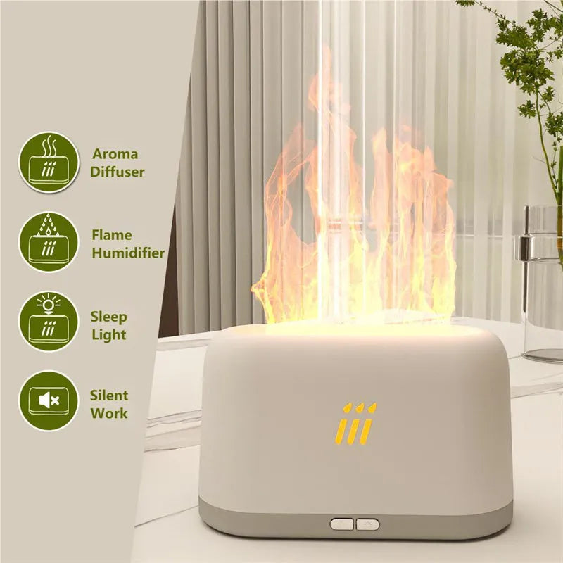 Black round flame aroma diffuser humidifier with LED lights and remote control on a table.