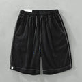Men's green linen straight shorts with drawstring waist on hanger