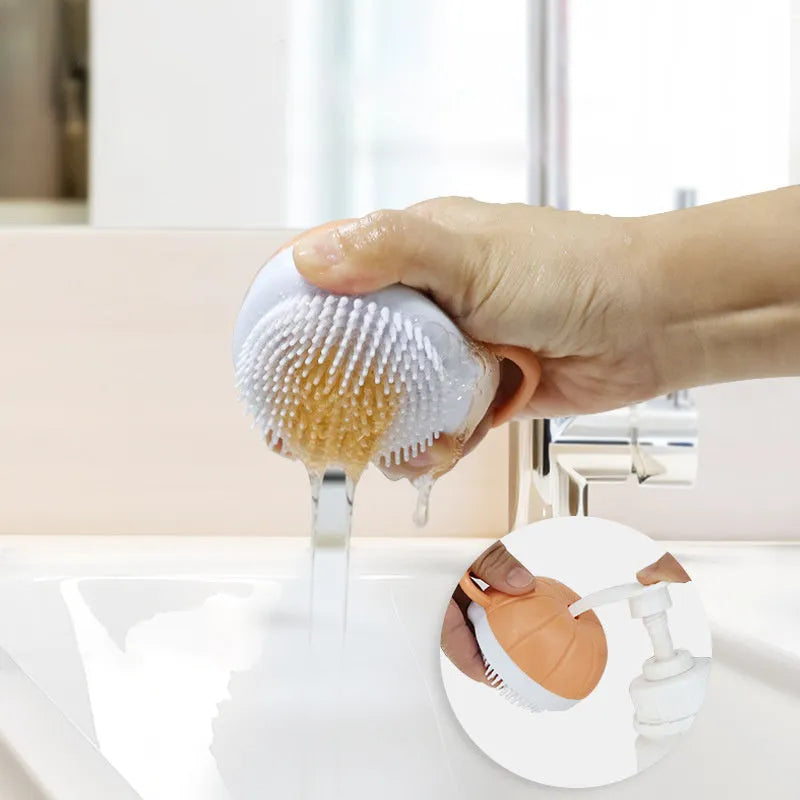 Orange dog bath brush with shampoo dispenser and soft TPR bristles on a curved pumpkin-shaped handle.