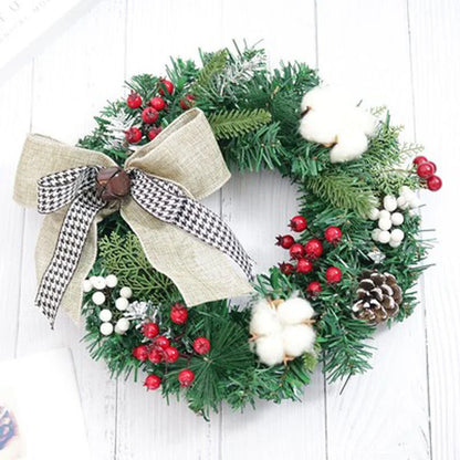 Festive Christmas wreath with artificial pine cones, berries, and maple leaves for elegant holiday decor