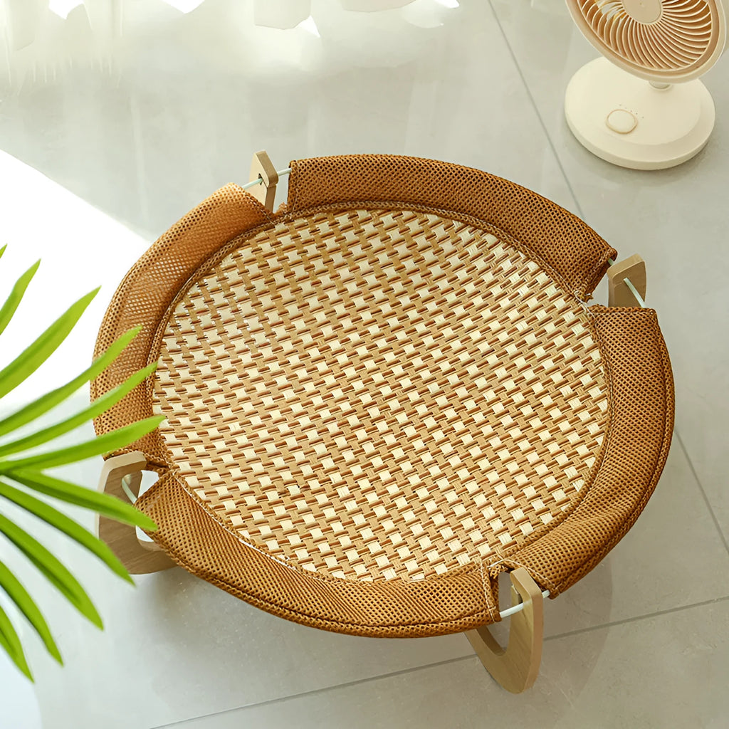 Brown woven rattan pet hammock measuring 46cm square with open weave design