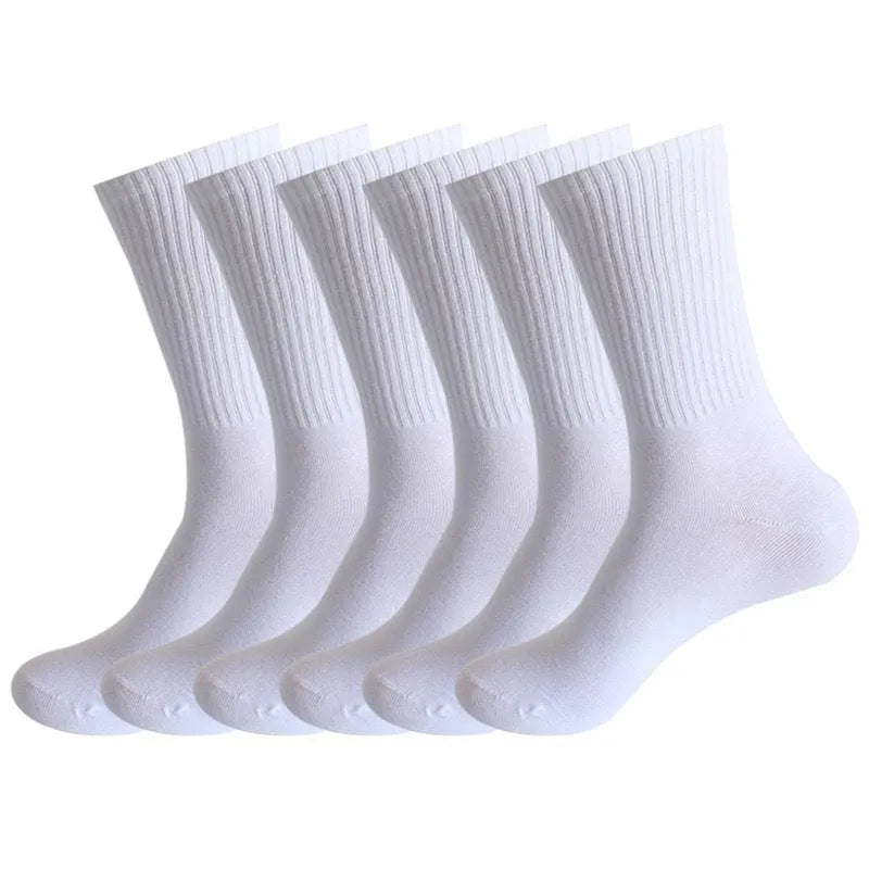 A pair of black mid-calf sports socks made from polyester cotton fabric.