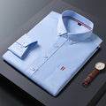 Men's casual polyester dress shirt in blue, available in sizes M to 4XL for daily business wear