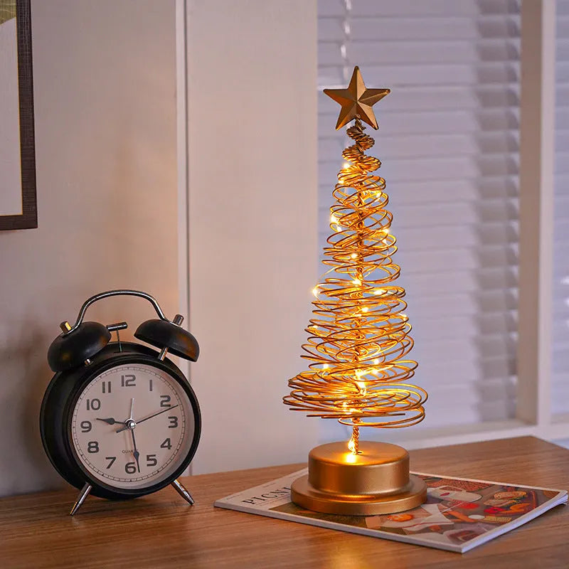Metal spiral Christmas tree table lamp with warm white LED lights, 33cm tall.