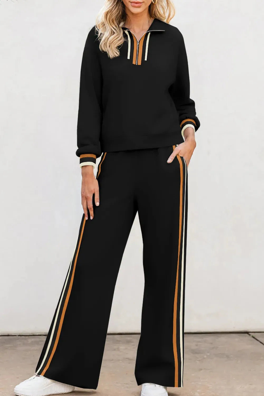 Black striped patchwork quarter zip pullover and loose pant set for women, two-piece outfit in polyester viscose elastane blend.