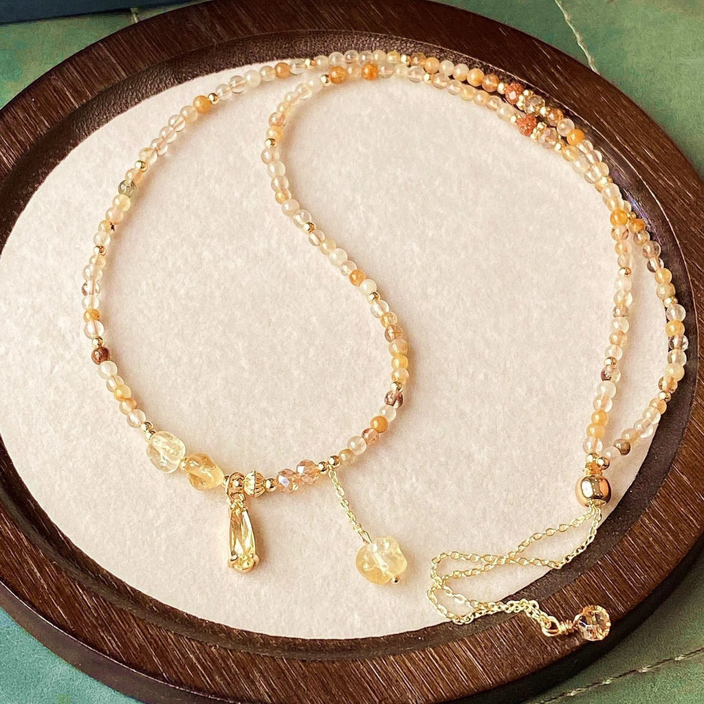 Women's natural citrine crystal bracelet with caramel layers and Saturn ring charm in gold finish