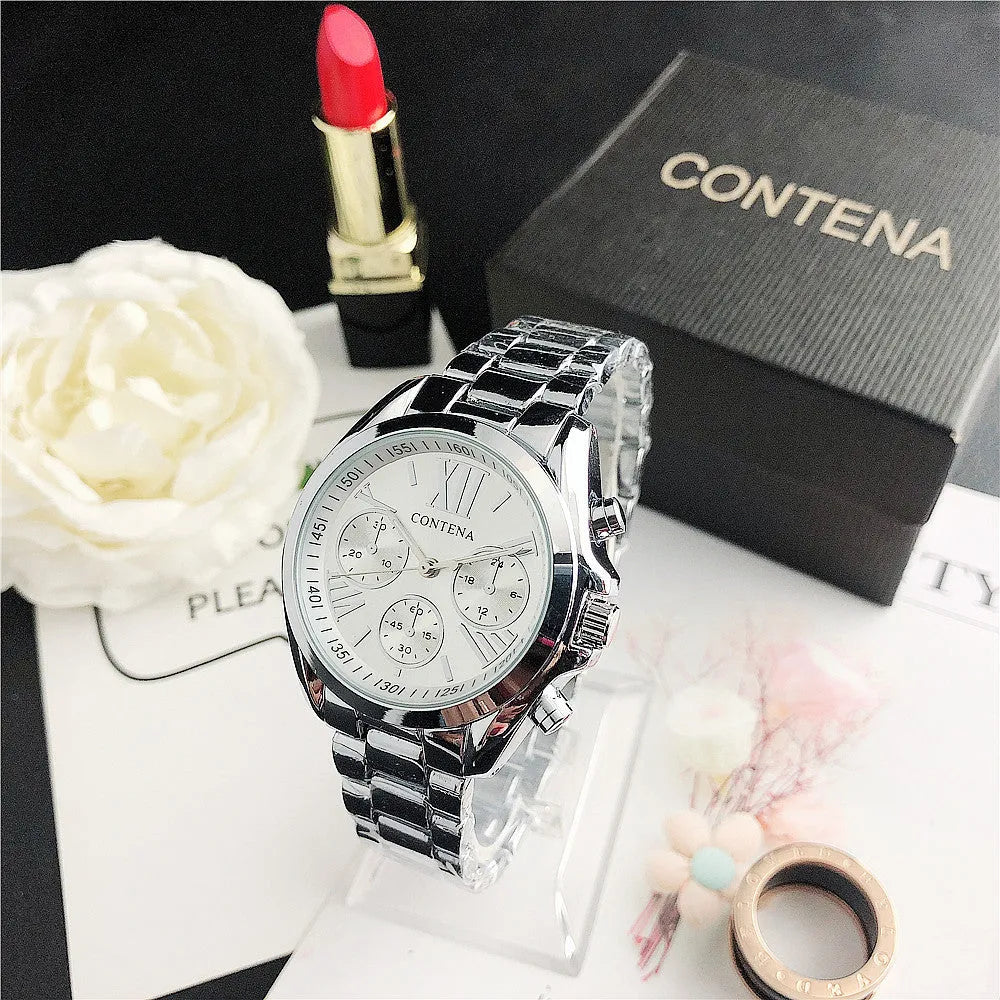Women's silver rose gold fashion watch with mesh strap and pointer display.