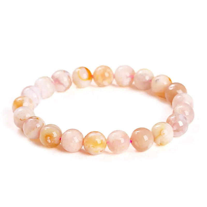 Cherry agate bracelet in natural cherry blossom colour with round geometric beads.