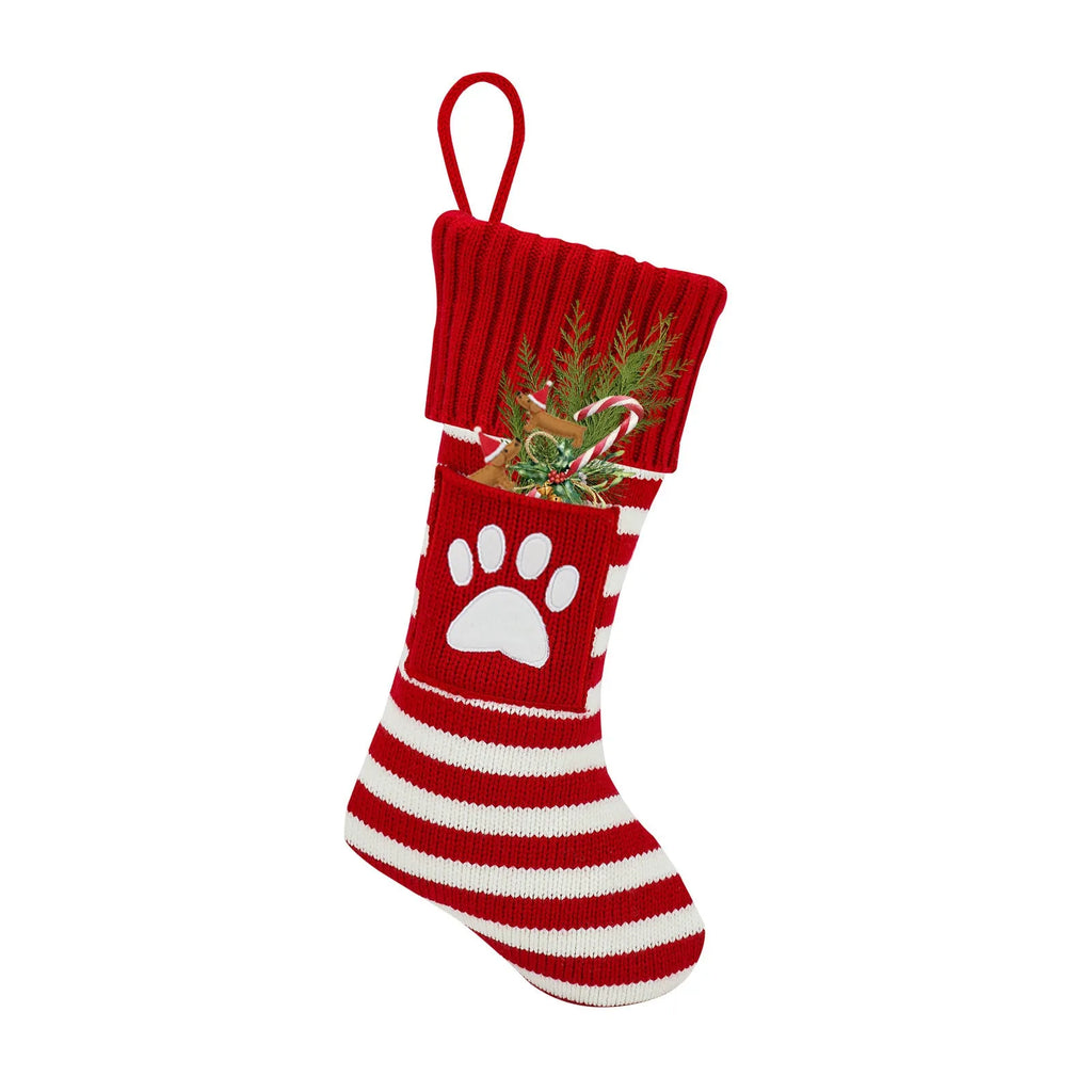 Christmas knitted cat and dog socks gift bag with red snowflake design on a festive background