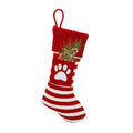 Christmas knitted cat and dog socks gift bag with red snowflake design on a festive background