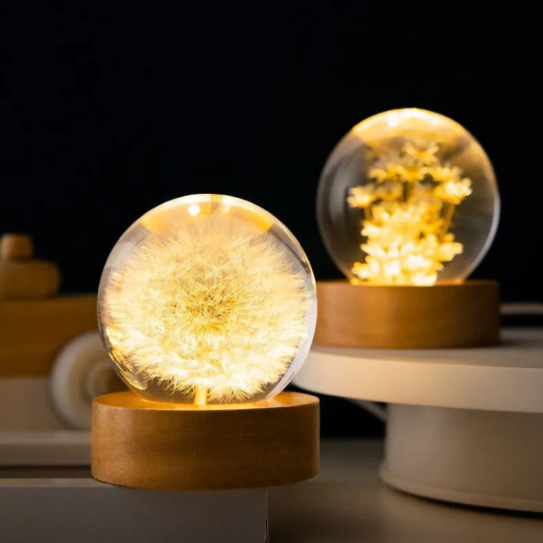 3D dandelion eternal flower night light in resin crystal ball on beech wood stand.