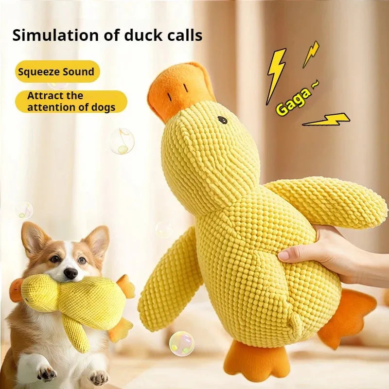 Yellow plush duck dog toy with squeaker for chewing and calming, size option shown