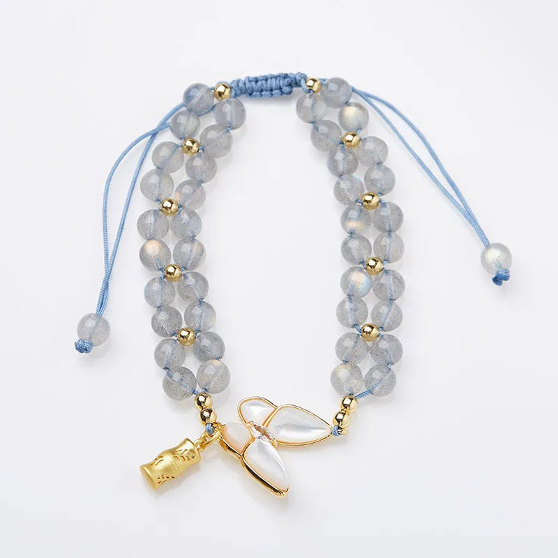 Grey moonstone woven bracelet with butterfly knots and geometric retro design