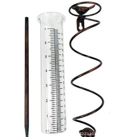 Traditional cast iron bird design outdoor rain gauge with glass measurement chamber showing 1-20 scale