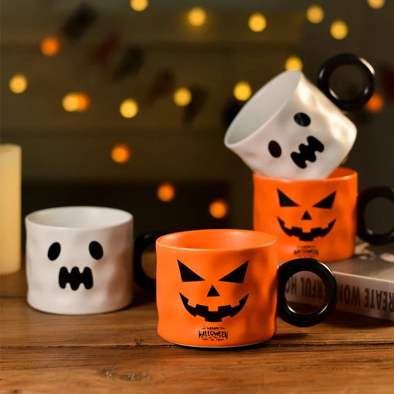 Festive Halloween pumpkin-shaped ceramic mugs in orange and white colors