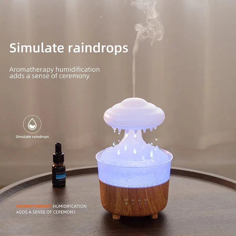 Wood grain white rain cloud shaped humidifier, diffuser, and night light on a table.