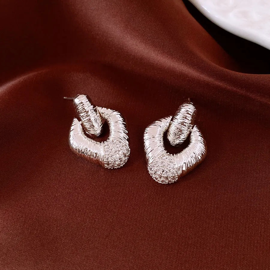 Copper diamond stud earrings with quadrilateral shape and silver needle finish for women