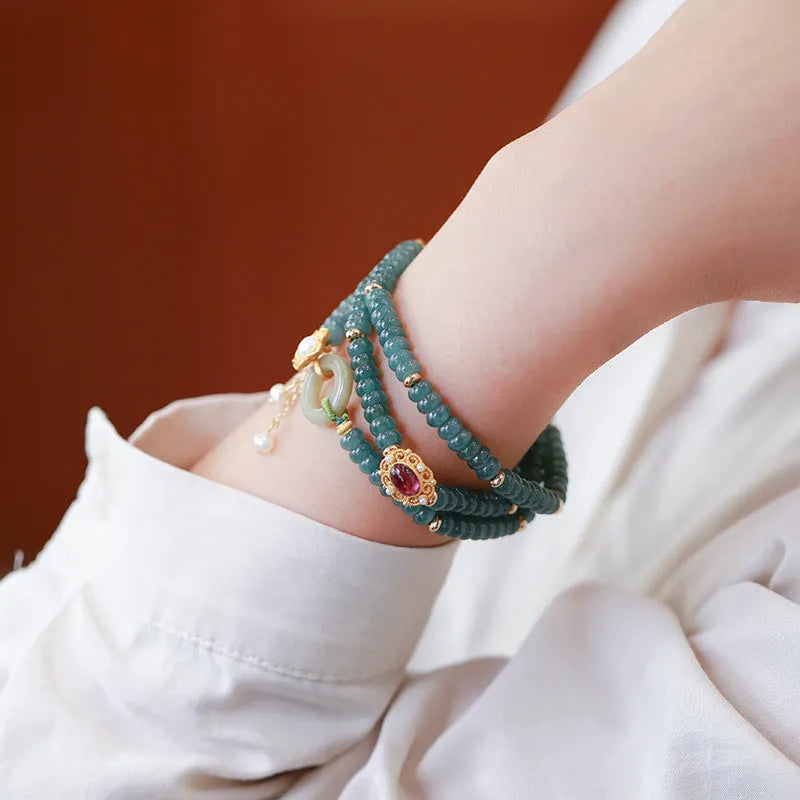 Blue water jade abacus bead and tourmaline bracelet on three sterling silver rings for women.