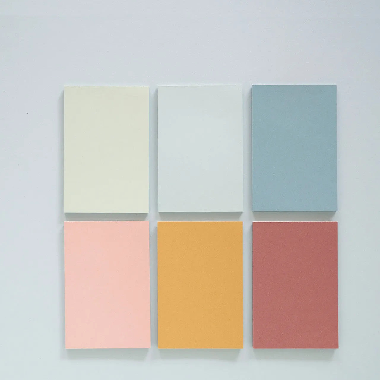 Large 12cm by 8cm colourful Post-it notes showing six different colours in a self-adhesive sticky note pack