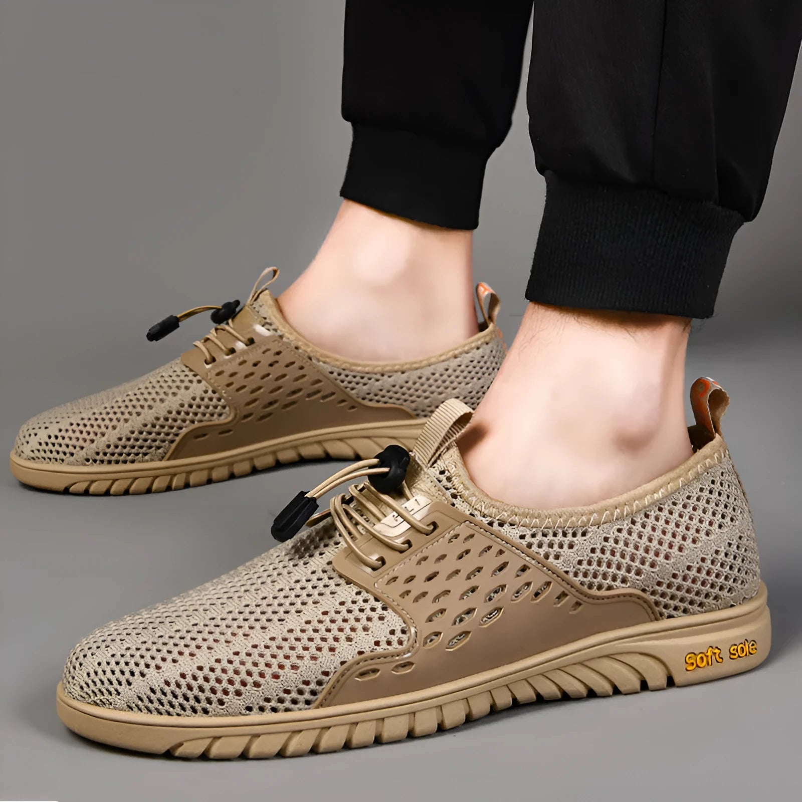 Men's black mesh casual shoes with elastic band fastening and rubber sole