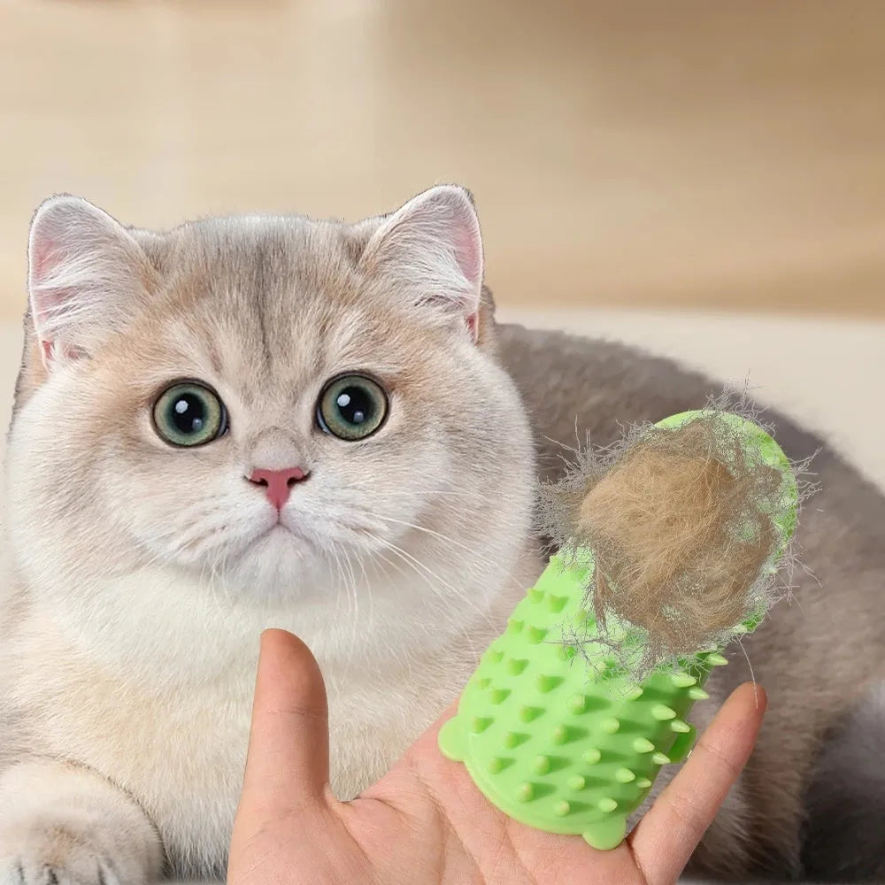 Silicone cat grooming comb with adjustable strap mounted on a table leg.