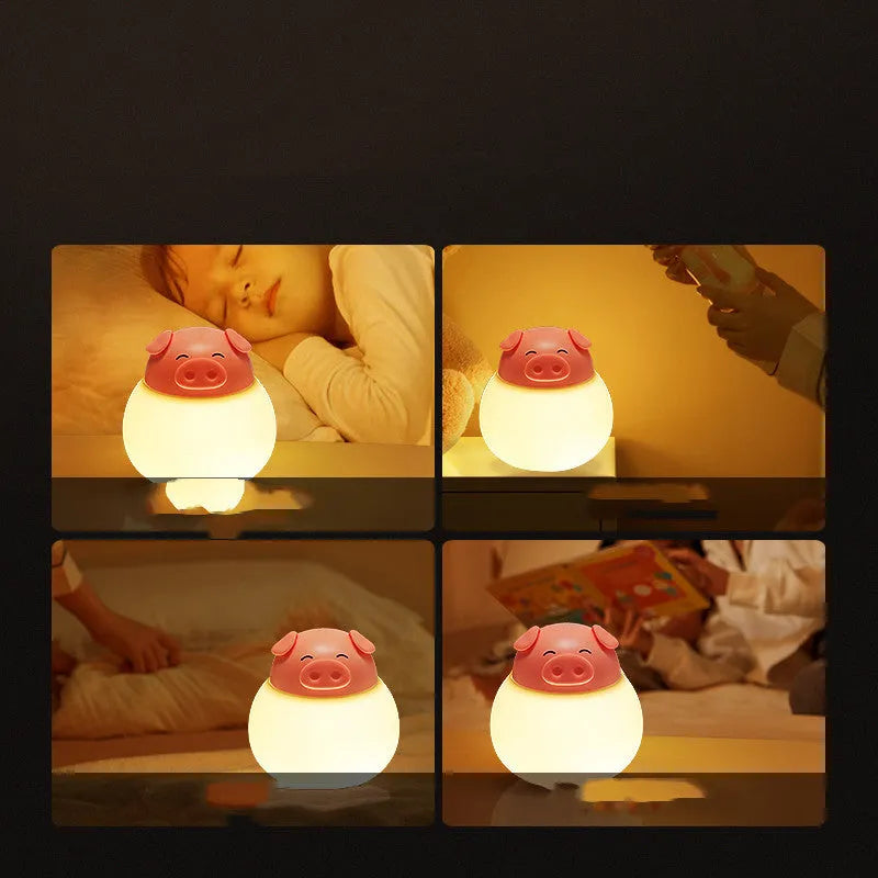 Pink pig silicone pat bedside lamp with USB LED light source on a table