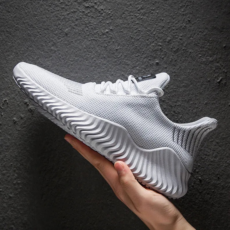Men's breathable ultra-light running shoes with white upper and grey sole, side view