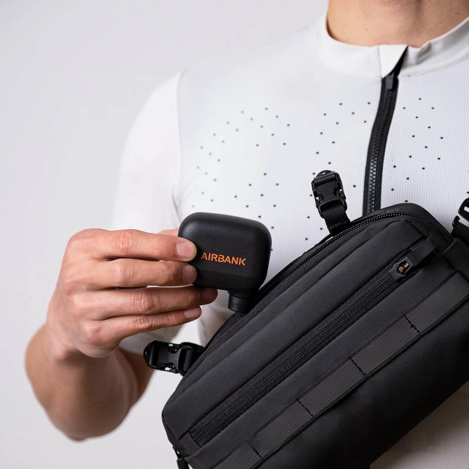 Black electric bicycle tyre inflator pump with USB charging cable and waterproof storage bag