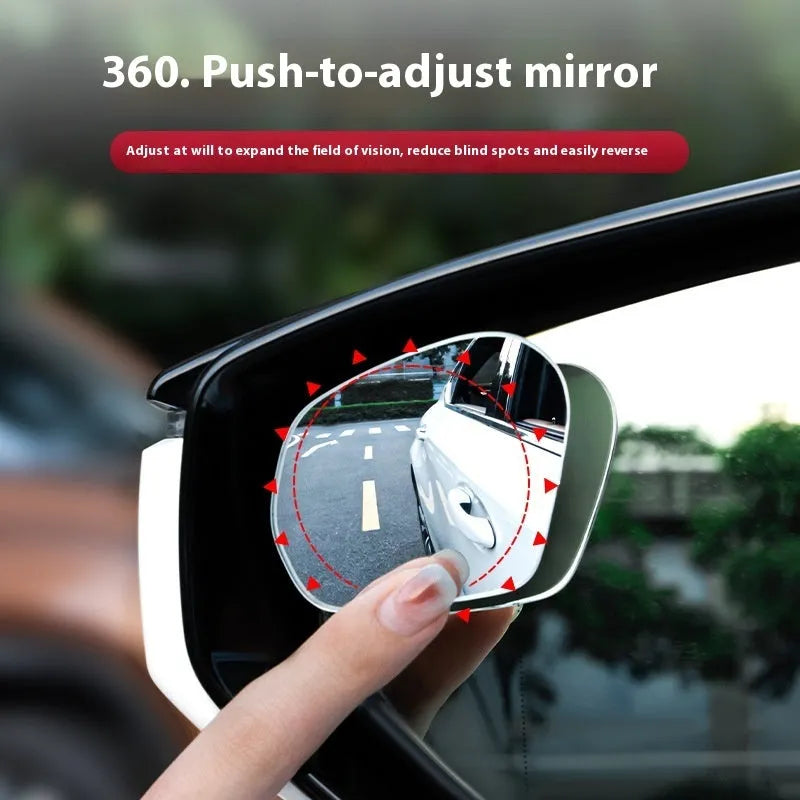 Pair of 360-degree wide-angle suction cup car mirrors in black, white, and silver on a car windscreen