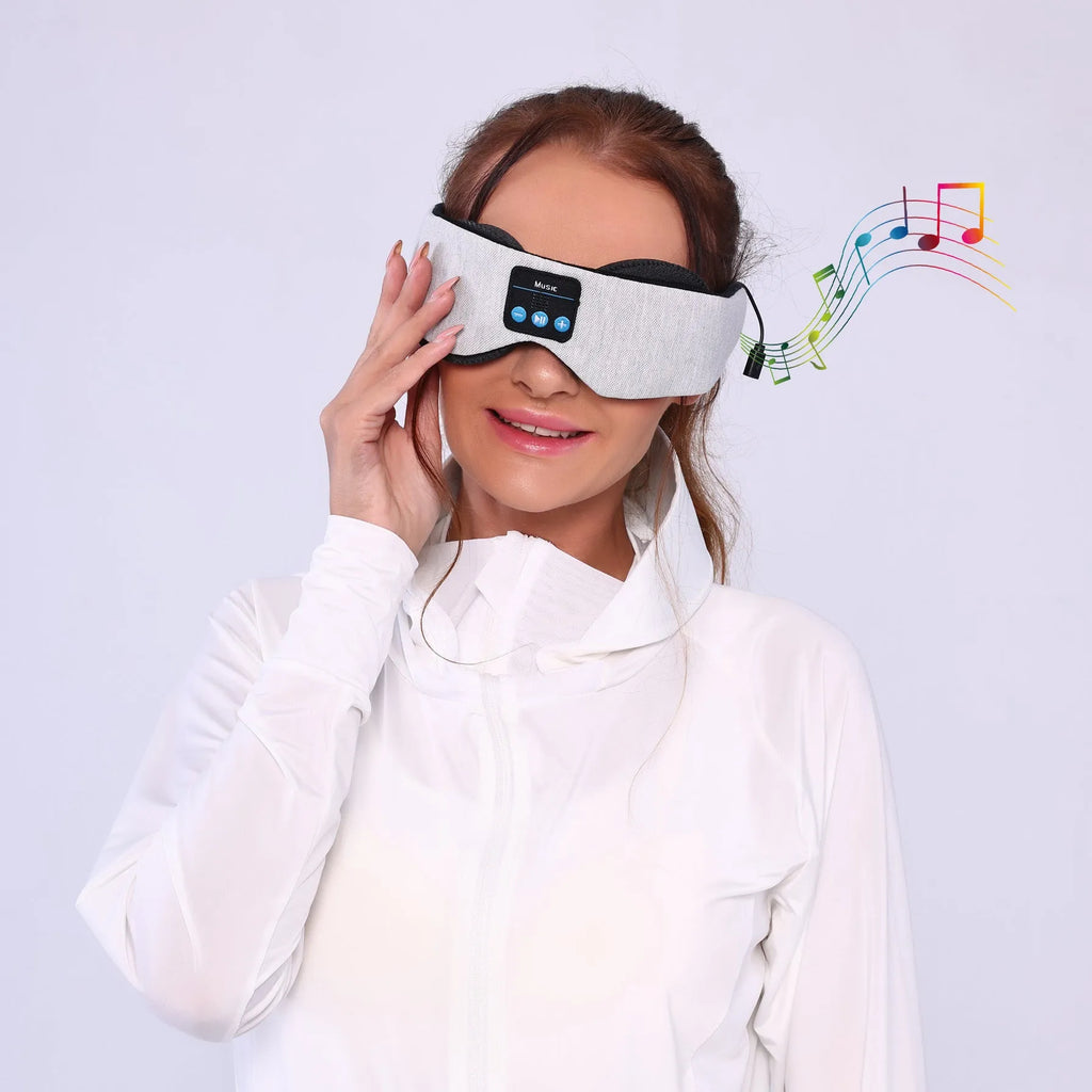 Grey Bluetooth sleeping eye mask with outline design showing integrated speaker placement