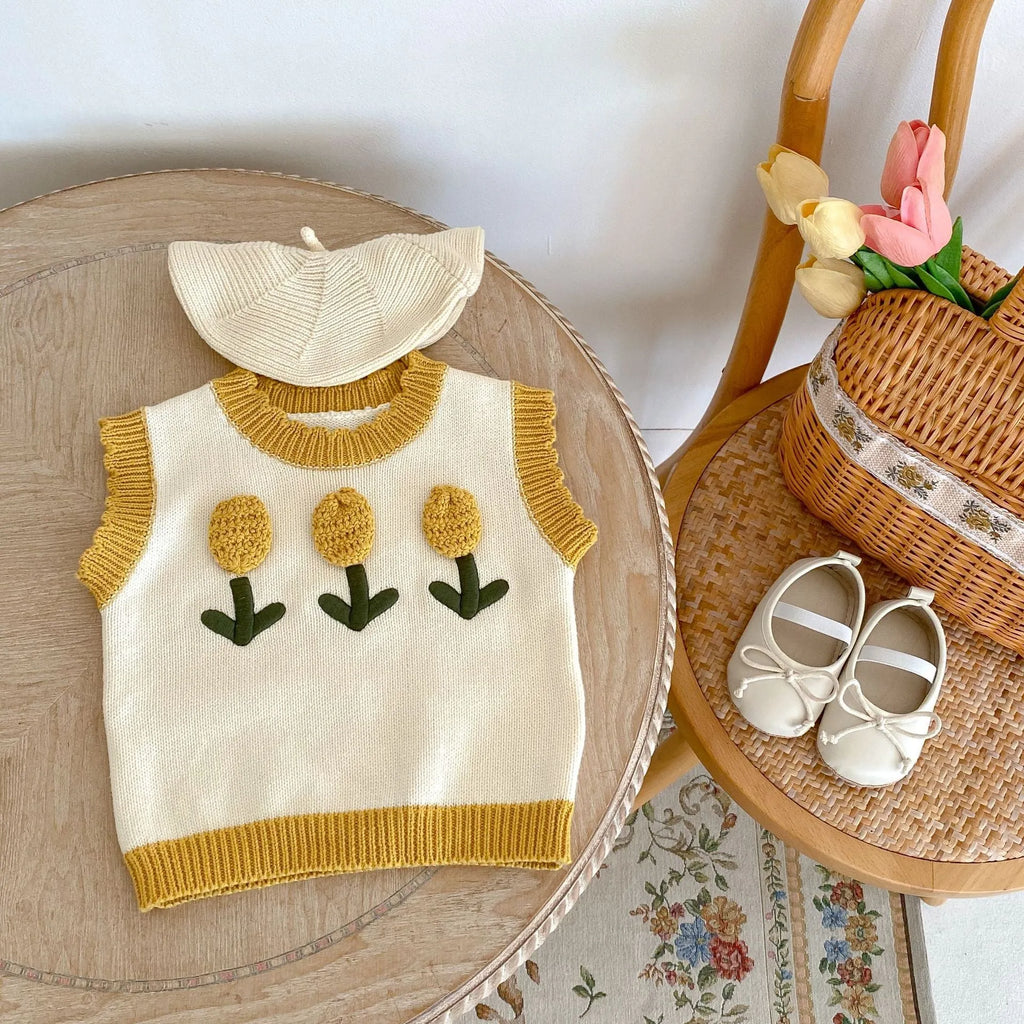 Baby girl sleeveless knitted pullover top in almond white with three-dimensional flower detail, spring autumn cotton knit