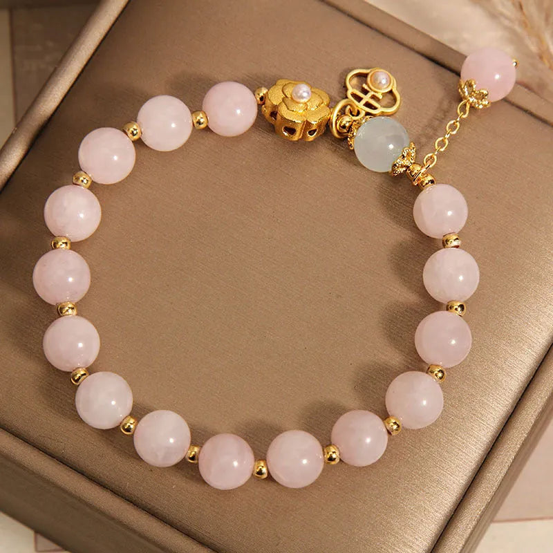 Women's pink crystal flower bracelet with adjustable fit on wrist