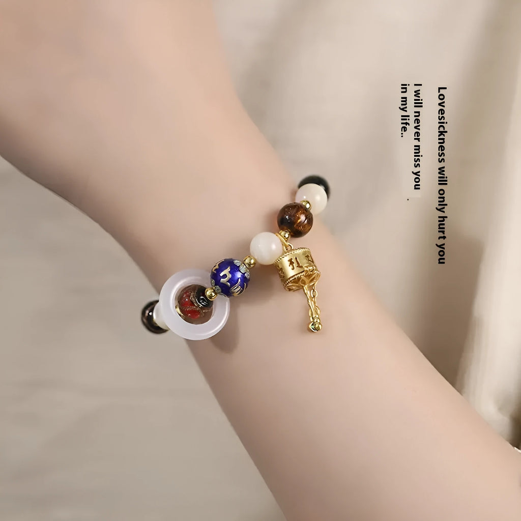 Hand-woven fragrant grey coloured glaze bracelet with natural stone beads on wrist