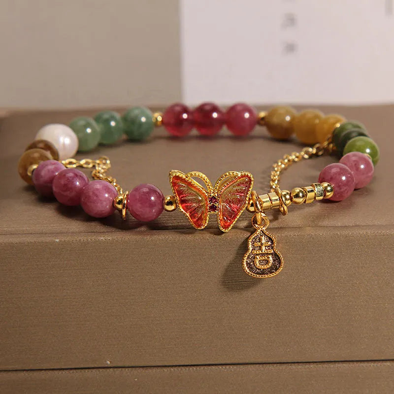 Natural jade coloured agate bracelet for women with butterfly and gourd shaped beads.