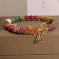 Natural jade coloured agate bracelet for women with butterfly and gourd shaped beads.