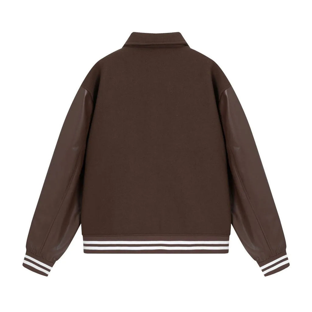 Apricot and brown woolen jacket with embroidered bone pattern detail on front.