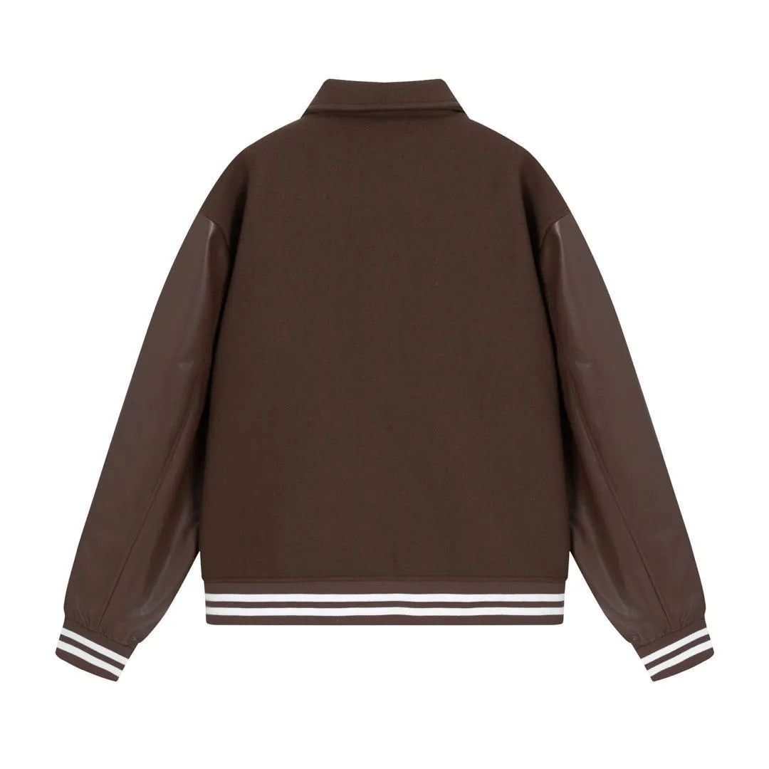 Apricot and brown woolen jacket with embroidered bone pattern detail on front.