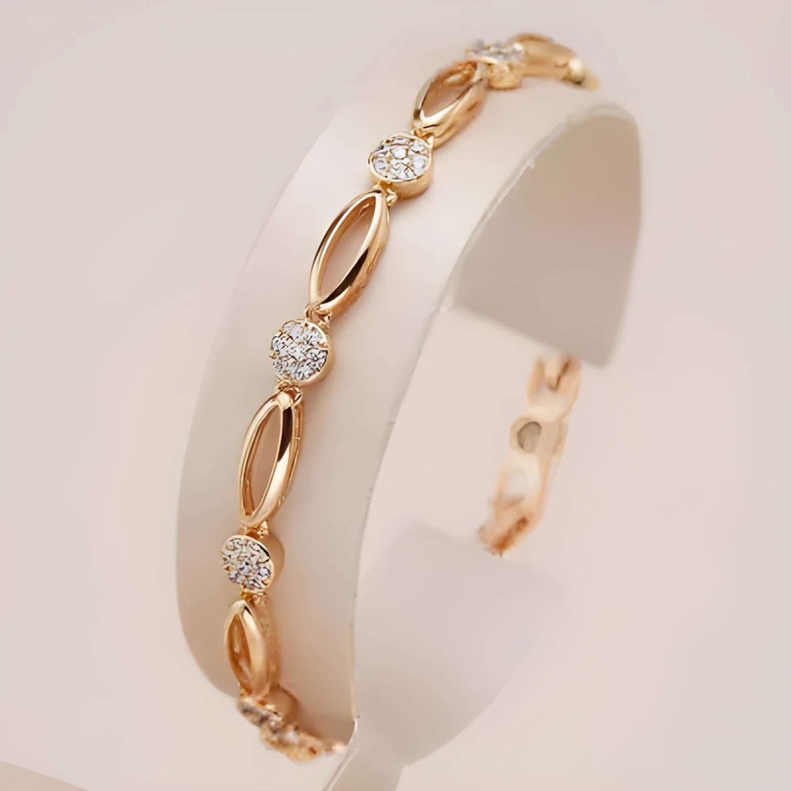 Golden copper hollow carved U-shaped bracelet for women on a plain background.