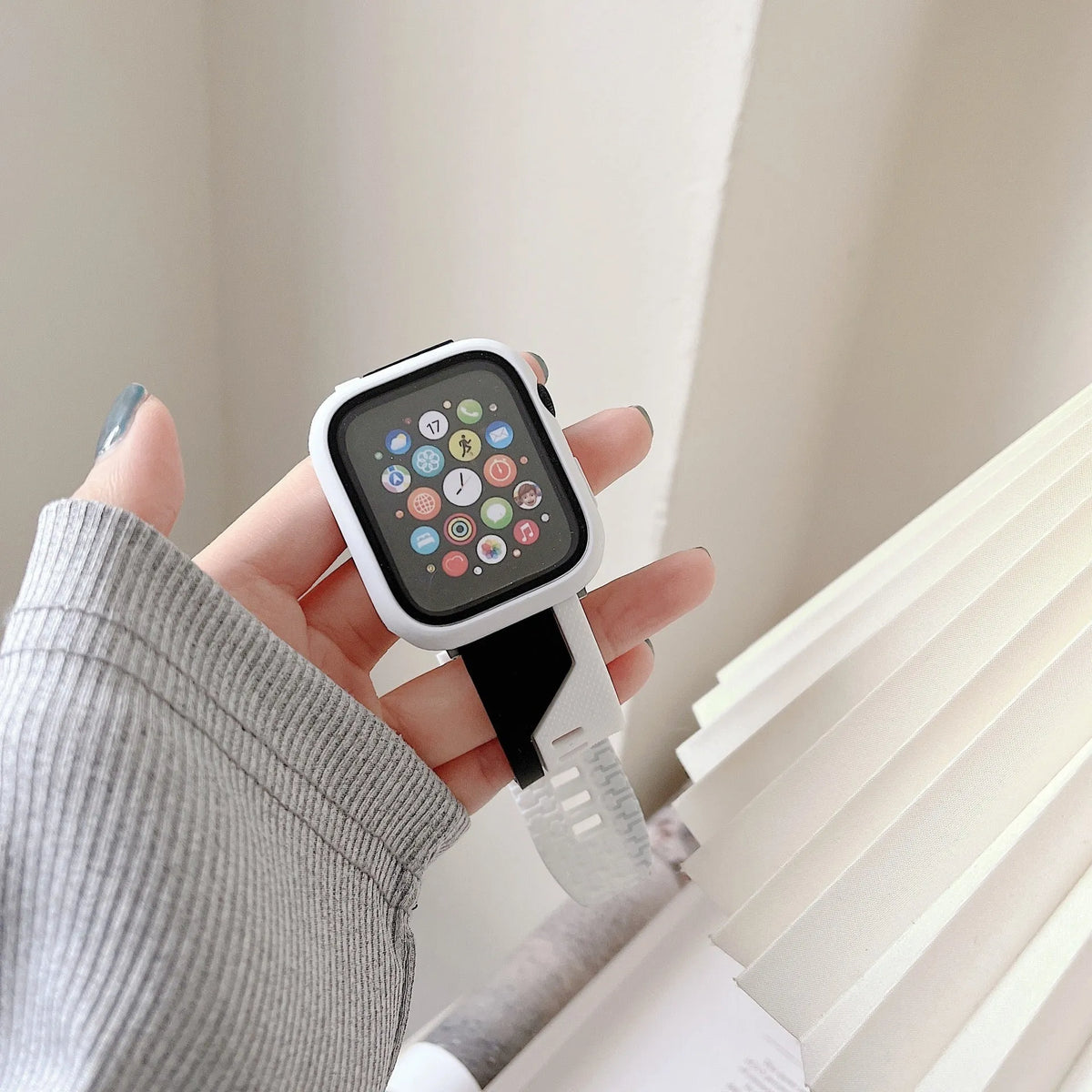 Two-tone silicone Apple Watch strap and protective case in 38mm to 45mm sizes, shown in black and white colour.