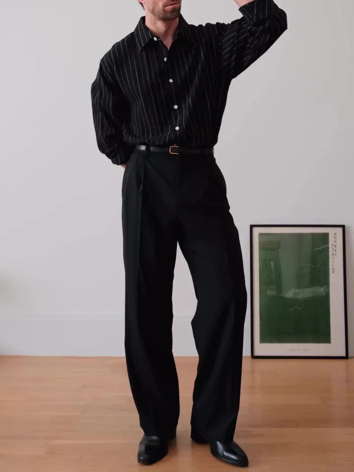 Men's black pinstriped button-down polyester shirt with long sleeves and a regular fit.