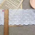 Close-up of white cotton embroidered lace trim showing cut-out pattern, with four width style options for DIY sewing.