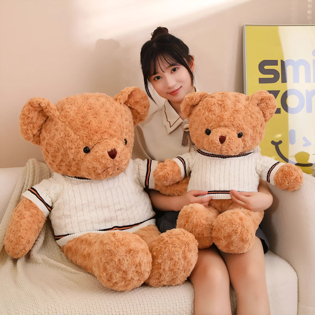 White sweater teddy bear plush doll with PP cotton filling and cloth velvet cover, shown in front view