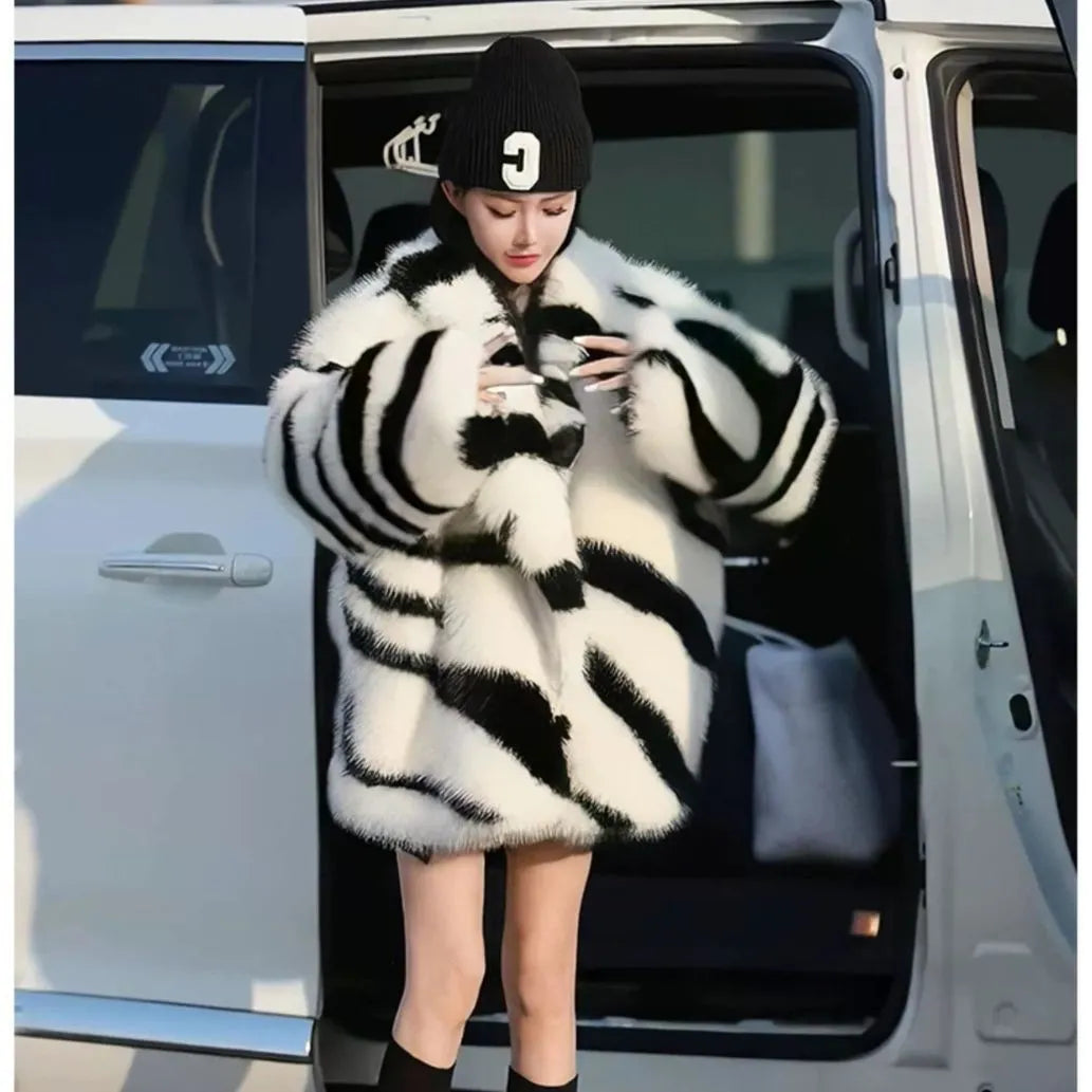 Women's long sleeve zebra stripe top with large skimmer collar and fur effect fabric