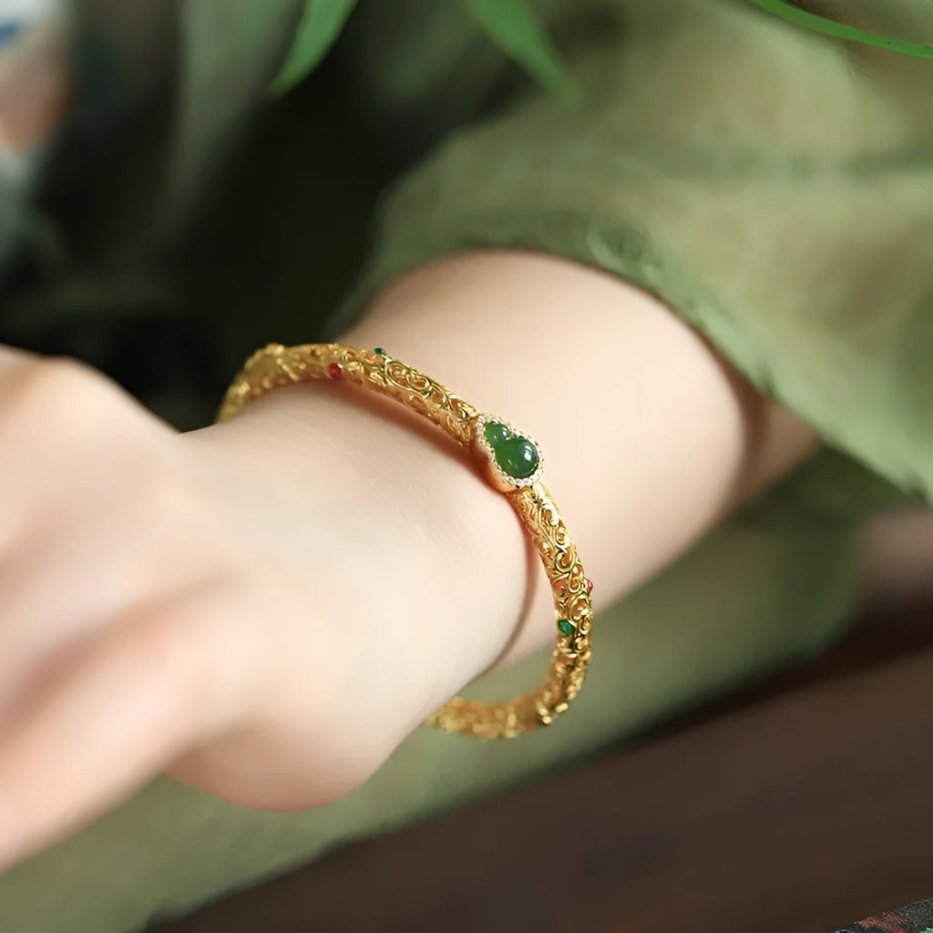 Gold-plated women's open cuff bracelet with xiangyun gourd charm on copper electroplated construction