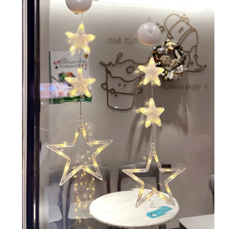 Three Christmas LED pendant lights with suction cups showing star, tree, and snowflake designs