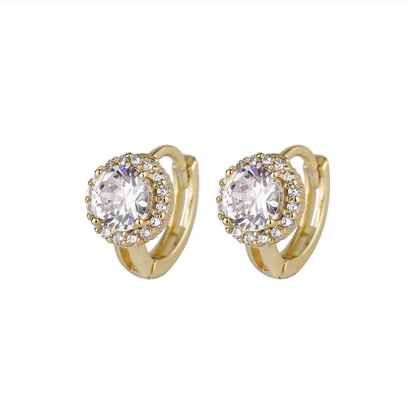 Women's geometric copper earrings with 14K yellow electroplated finish on white background