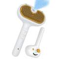 White pet grooming water brush with steam spray function for dogs and cats showing self-cleaning mechanism