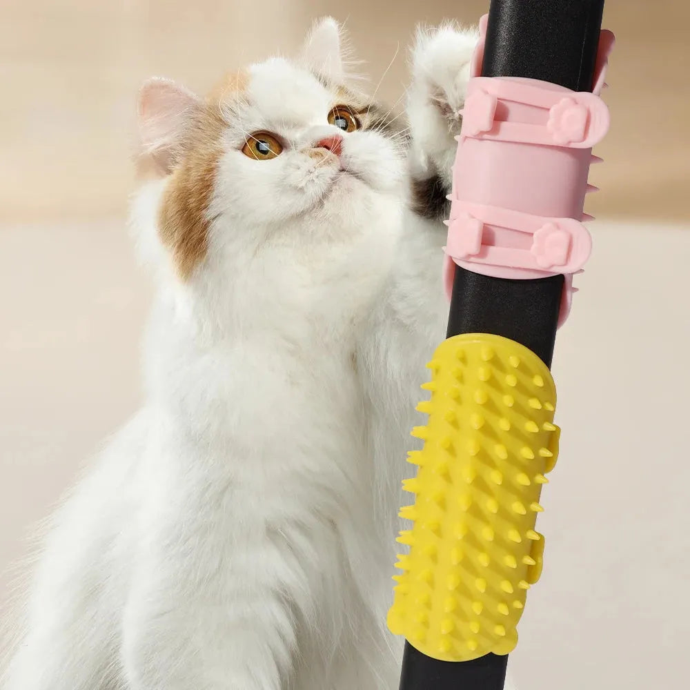Silicone cat grooming comb with adjustable strap mounted on a table leg.